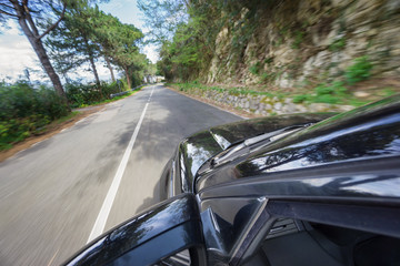 Fototapeta na wymiar car driving at high speed in mountain road