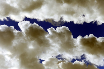 white smoke against the blue sky