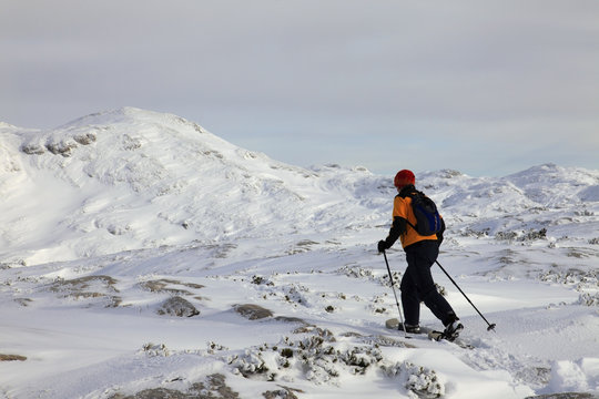 Snowshoeing on mountain plateau Dachstein-Krippenstein. Austria.