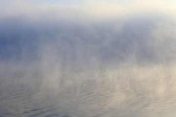 Obraz na płótnie Canvas dense fog over the river