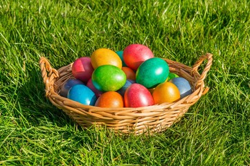 Colorful eggs in a basket
