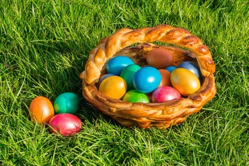 Colorful eggs in a basket