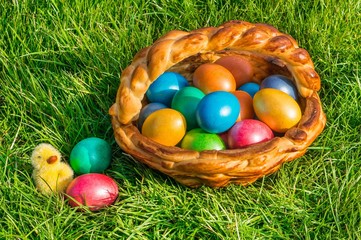 Colorful eggs in a basket