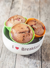 Homemade strawberry and orange muffins close up