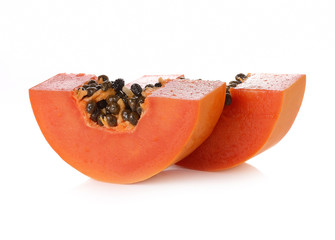 sliced papaya on a white background