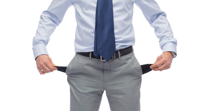 Close Up Of Businessman Showing Empty Pockets