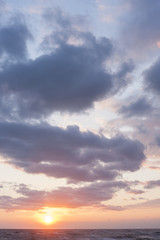 Clouds, sun and sea