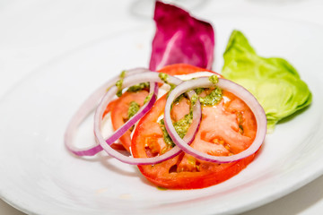 Sliced Tomatoes with Pesto and Onions