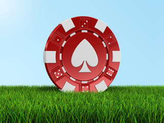 chip of casino on grass (clipping path included)