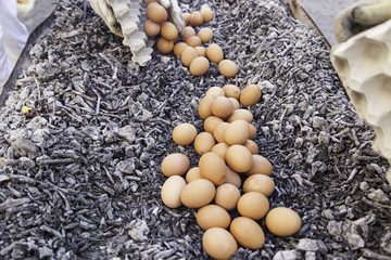 Eggs in a charcoal grilling