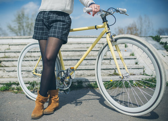 fashionable woman with vintage bike