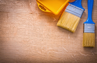 organized copyspace aerial view two paintbrushes with blue handl
