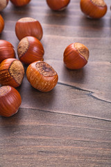 tasty hazelnuts on vintage wooden board food and drink concept
