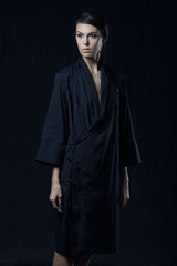 Fashion photo of young magnificent woman in black shirt