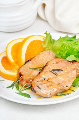 Baked pork chop with orange sauce