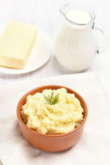 Mashed potato, milk jug and butter