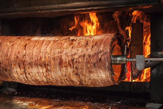 Turkish doner kebab is preparing in an oven with open fire