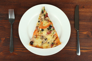 Slice of tasty pizza on the plate