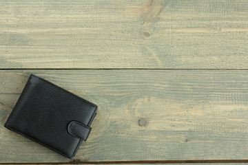 Stylish men's purse on wood background