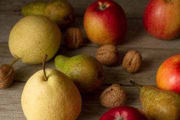 Naklejka na ściany i meble pear with apples on a brown background