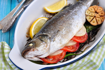 baked fish with herbs, vegetables and garlic