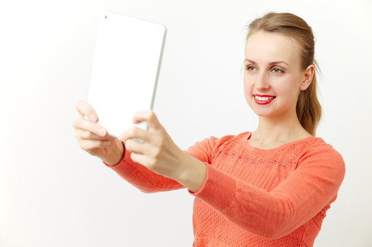 Woman making selfie on tablet