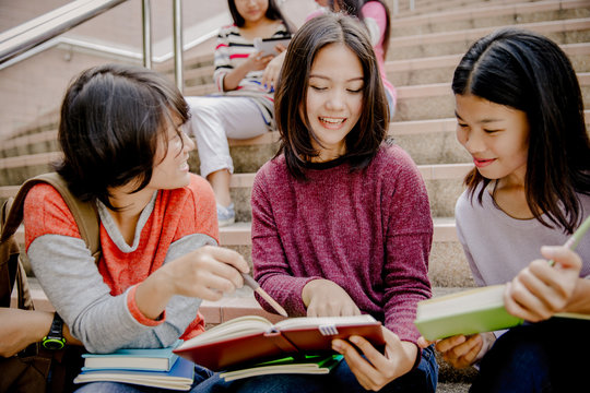 group of happy teen high school students outdoors