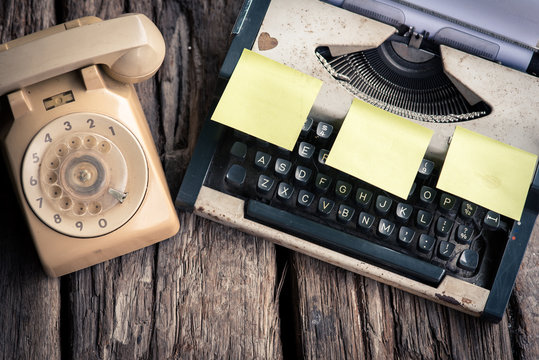 Typewriter with coffee cup, sepia tone.