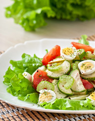 Salad of tomatoes, cucumbers and quail eggs