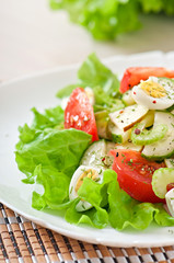 Salad of tomatoes, cucumbers and quail eggs