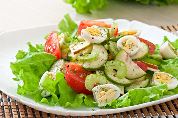 Salad of tomatoes, cucumbers and quail eggs