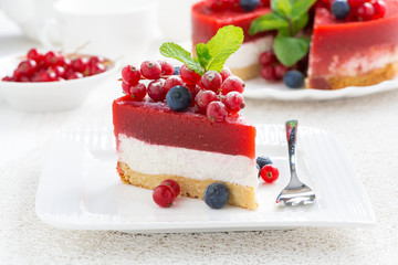 piece of cheesecake with berry jelly on a plate