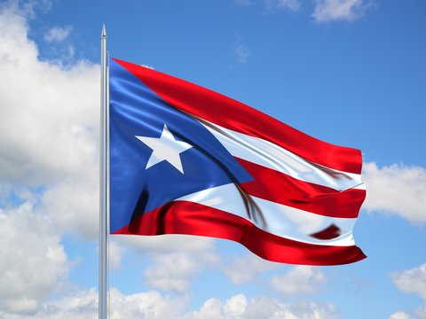 Puerto Rico 3d flag floating in the wind in blue sky
