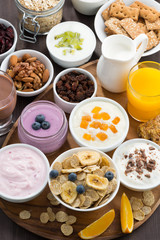 rich breakfast buffet with cereals, yoghurt and fruit