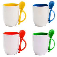 colored mugs with spoons