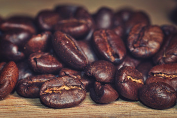 Coffee beans, macro close-up with retro vintage filter.