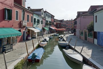 Fototapeta na wymiar Colorful houses and canal on Burano island, near Venice, Italy