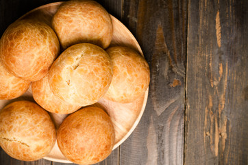 Homemade buns on wooden plate