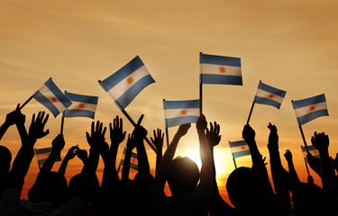 Silhouettes People Holding Flag Argentina Concept