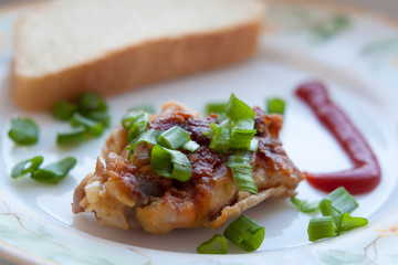 grilled meat and onions skhlekbom on a plate