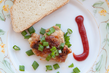 grilled meat and onions skhlekbom on a plate