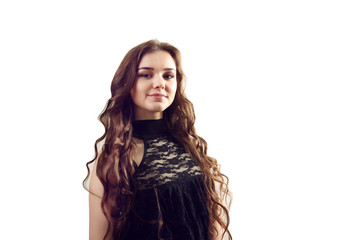 A picture of a young beautiful woman in a black dress posing ove