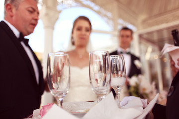 Bride and groom on their wedding day celebrating with champagne