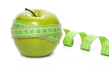 Green apple with measurement isolated on white
