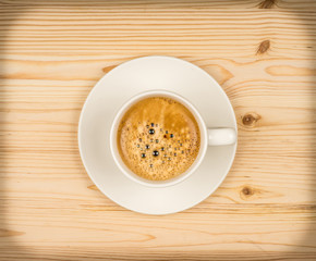 cup of fresh espresso on table, view from above