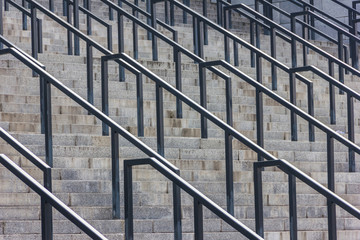 Stone steps with black metal railing