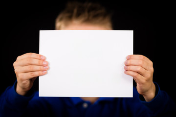 Child with blank white sign