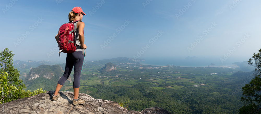 Poster lady hiker on the mountain