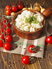 dumplings with meat on a wooden table
