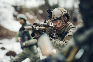 young soldiers with guns